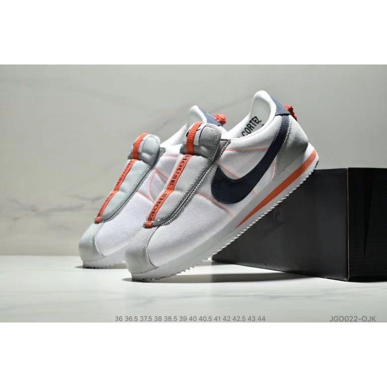 Tenis nike clearance grises con naranja